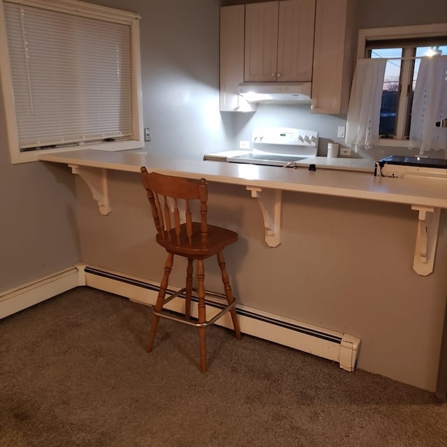 kitchen with range, baseboard heating, a kitchen bar, and dark colored carpet