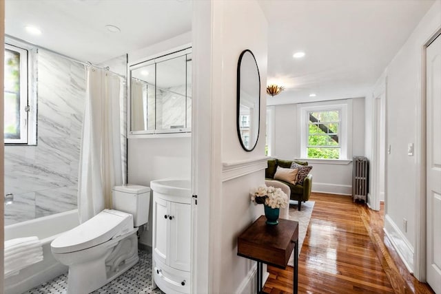 12 Lindall Pl Unit 3, Boston, MA 02114 - bathroom with radiator heating unit, toilet, vanity, shower / tub combo with curtain, and recessed lighting