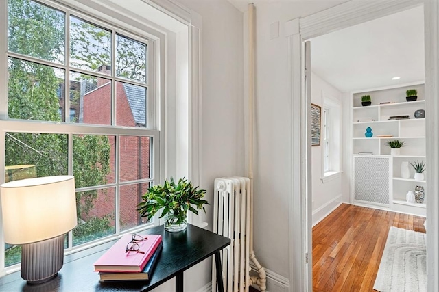 12 Lindall Pl Unit 3, Boston, MA 02114 - living area featuring radiator heating unit, baseboards, and hardwood / wood-style floors