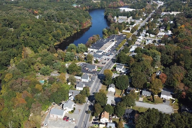 bird's eye view featuring a water view and a wooded view