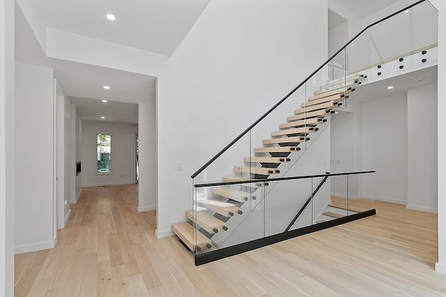 staircase featuring light hardwood / wood-style flooring