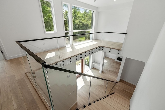 staircase with light hardwood / wood-style flooring