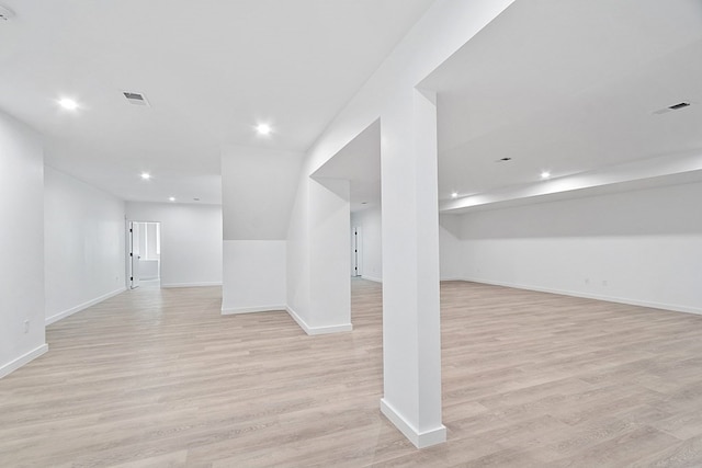 basement featuring light wood-type flooring