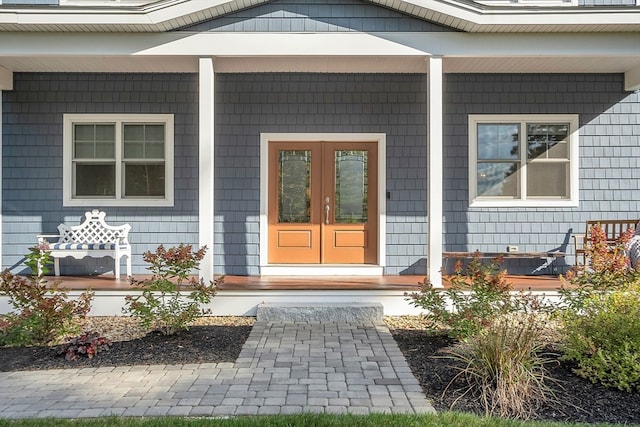 property entrance featuring french doors and covered porch