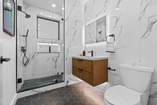 full bath featuring toilet, vanity, and a marble finish shower