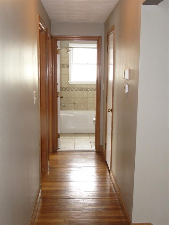 hall featuring hardwood / wood-style flooring