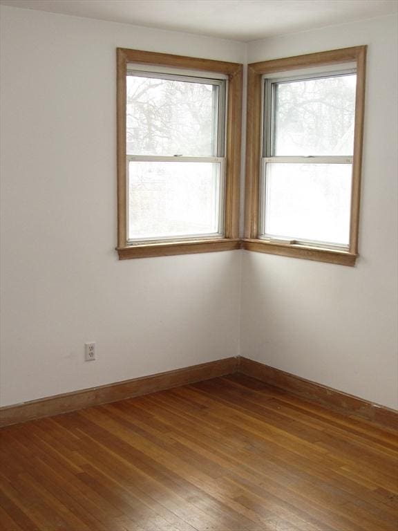 unfurnished room featuring wood-type flooring