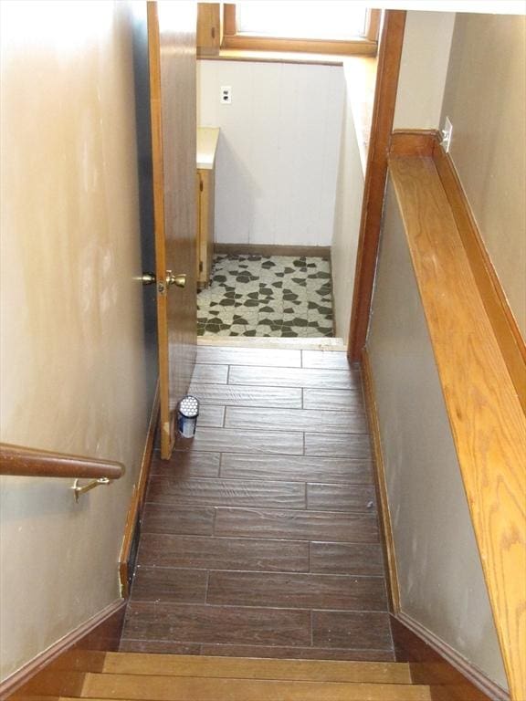 staircase featuring hardwood / wood-style floors