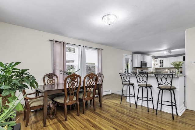 dining room with wood finished floors