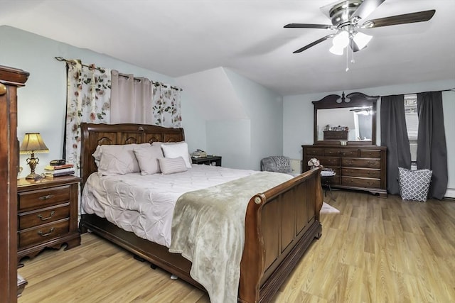 bedroom with light wood finished floors and a ceiling fan