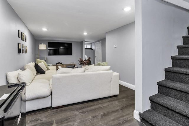 living room featuring stairs, dark wood-style flooring, baseboards, and recessed lighting