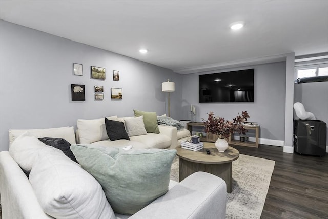 living room with dark wood-style flooring, baseboards, and recessed lighting