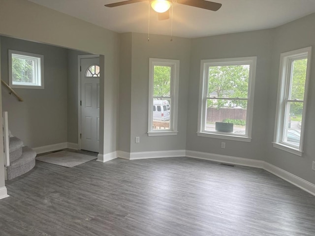 15 Forest St, Whitman, MA 02382 - unfurnished living room with ceiling fan, dark wood-style floors, and healthy amount of natural light