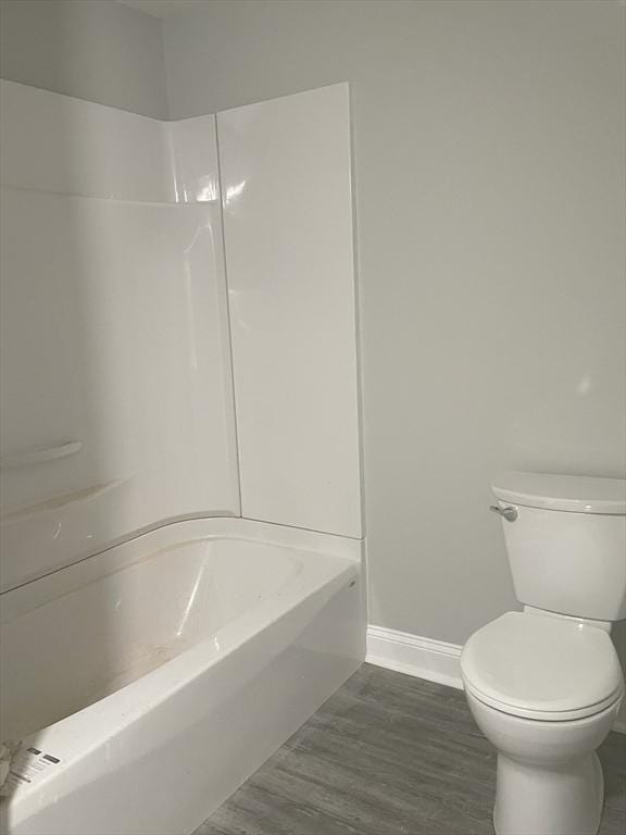 15 Forest St, Whitman, MA 02382 - full bathroom with baseboards, toilet, wood finished floors, and shower / bathtub combination