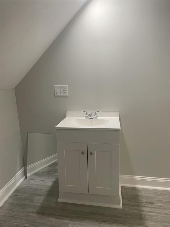 15 Forest St, Whitman, MA 02382 - bathroom featuring vanity, baseboards, wood finished floors, and lofted ceiling