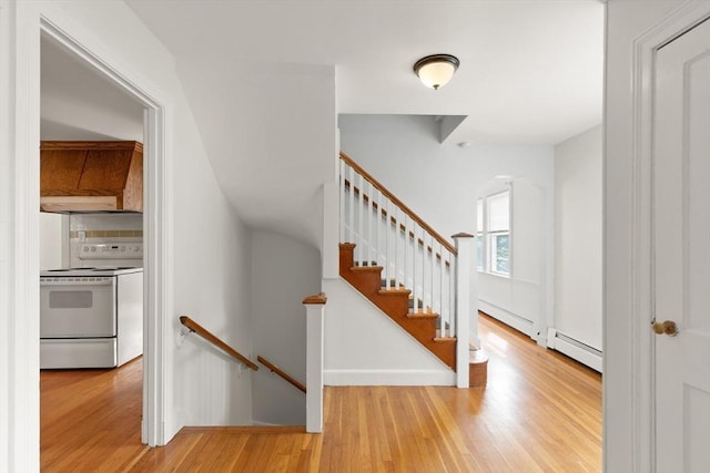 36 Kings Bch, Swampscott, MA 01907 - foyer featuring a baseboard heating unit, wood finished floors, and baseboard heating