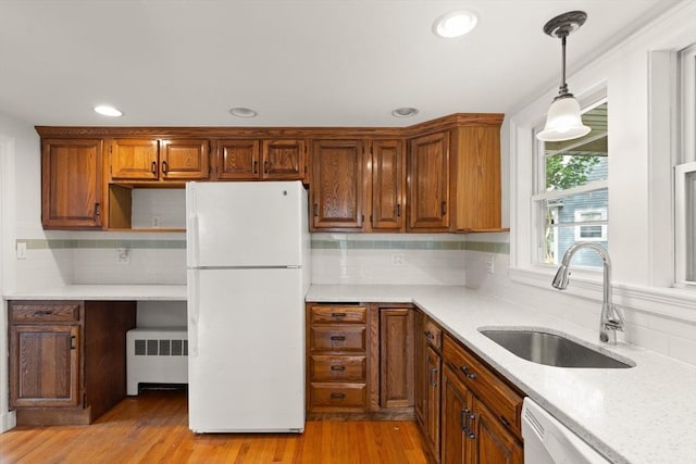 36 Kings Bch, Swampscott, MA 01907 - kitchen with white appliances, radiator, a sink, tasteful backsplash, and decorative light fixtures