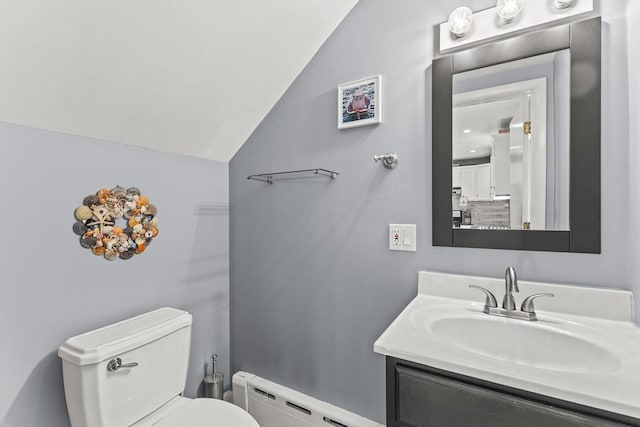 full bathroom featuring vanity, lofted ceiling, toilet, and a baseboard radiator