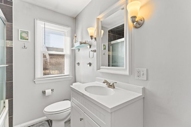 bathroom featuring an enclosed shower, baseboards, toilet, and vanity