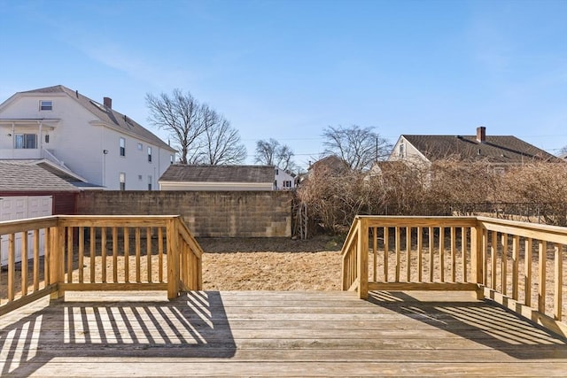 deck with a fenced backyard