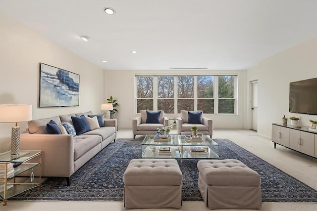 living area with recessed lighting and carpet