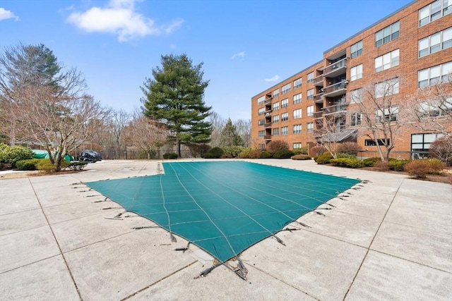 pool with a patio area