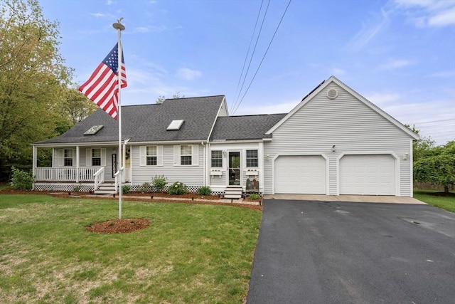 view of front facade featuring an attached garage, asphalt driveway, a front yard, covered porch, and roof with shingles