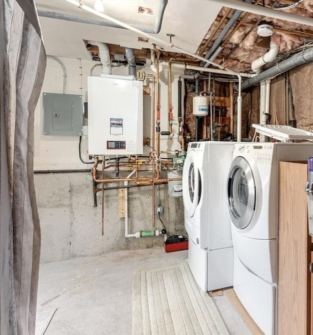 laundry area with electric panel and separate washer and dryer
