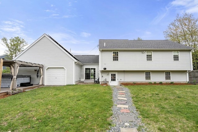 view of front of home with a hot tub, an attached garage, and roof with shingles