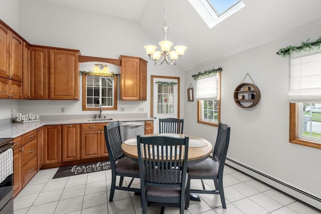 dining space featuring a baseboard heating unit, a chandelier, vaulted ceiling, a skylight, and light tile patterned floors