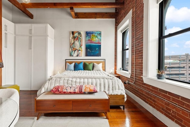 49 Munroe St Unit 405, Lynn, MA 01901 - bedroom with brick wall, wood finished floors, beam ceiling, and multiple windows