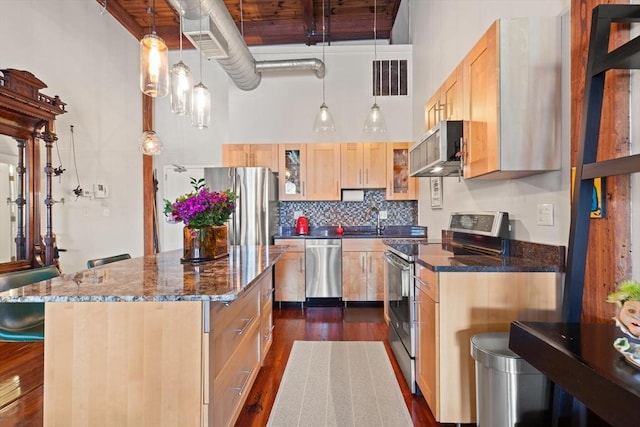 49 Munroe St Unit 405, Lynn, MA 01901 - kitchen with stainless steel appliances, light brown cabinetry, a towering ceiling, dark wood-style floors, and a kitchen island