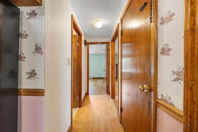 49 Whitman St, Weymouth, MA 02189 - hallway featuring light wood finished floors, wallpapered walls, and baseboards