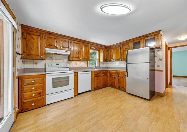 49 Whitman St, Weymouth, MA 02189 - kitchen featuring freestanding refrigerator, dishwashing machine, electric range, under cabinet range hood, and brown cabinets