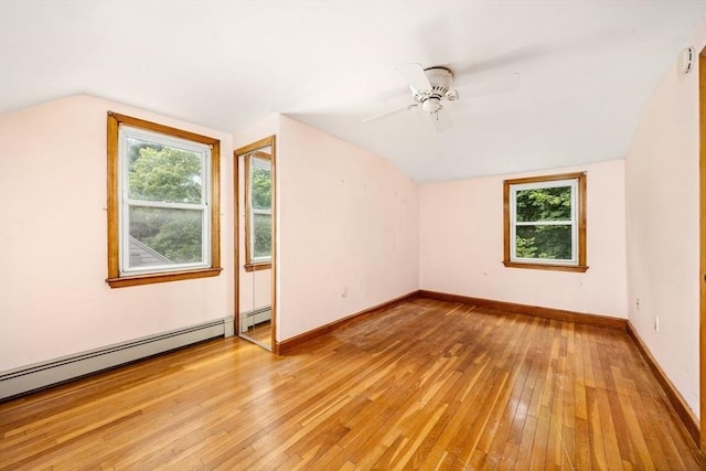 49 Whitman St, Weymouth, MA 02189 - additional living space with light wood-type flooring, vaulted ceiling, a ceiling fan, healthy amount of natural light, and baseboards
