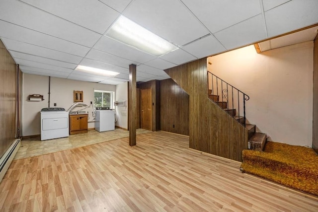 49 Whitman St, Weymouth, MA 02189 - below grade area with washer / clothes dryer, light wood-style flooring, baseboard heating, stairway, and a drop ceiling
