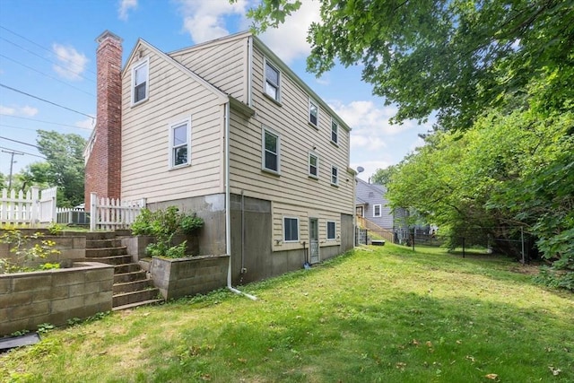 49 Whitman St, Weymouth, MA 02189 - back of property featuring a chimney and stairway
