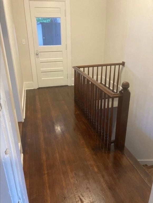 hallway with dark wood-type flooring