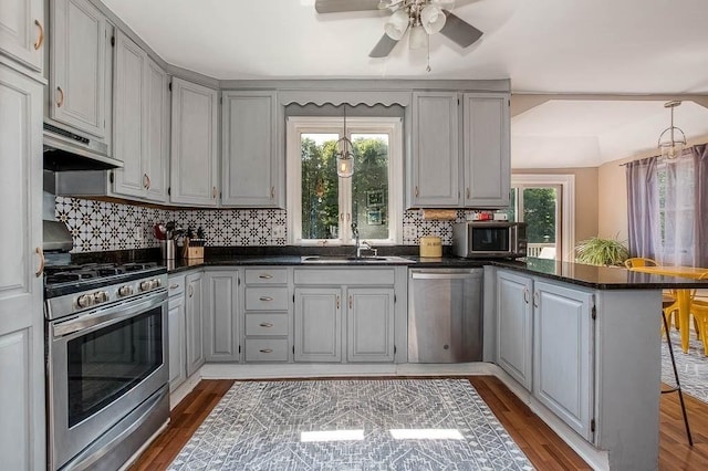 76 Colburn St Unit 76, Dedham, MA 02026 - kitchen with appliances with stainless steel finishes, a peninsula, and dark countertops