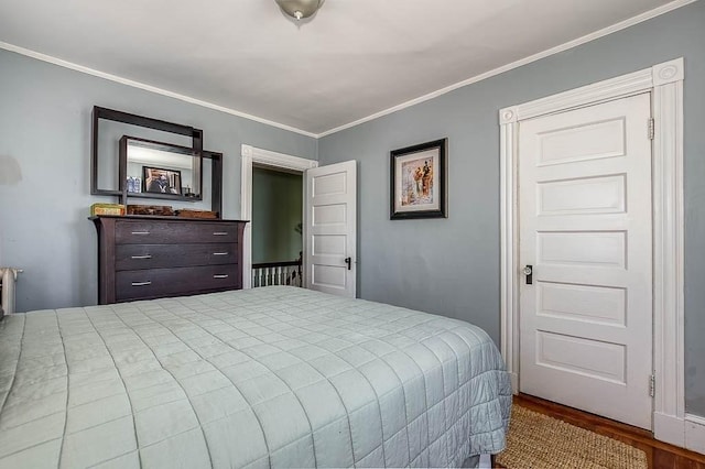 76 Colburn St Unit 76, Dedham, MA 02026 - bedroom featuring wood finished floors and crown molding