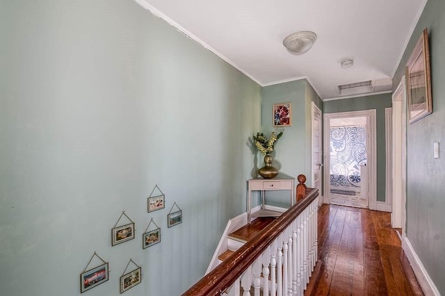 76 Colburn St Unit 76, Dedham, MA 02026 - corridor featuring dark wood finished floors, crown molding, an upstairs landing, and attic access