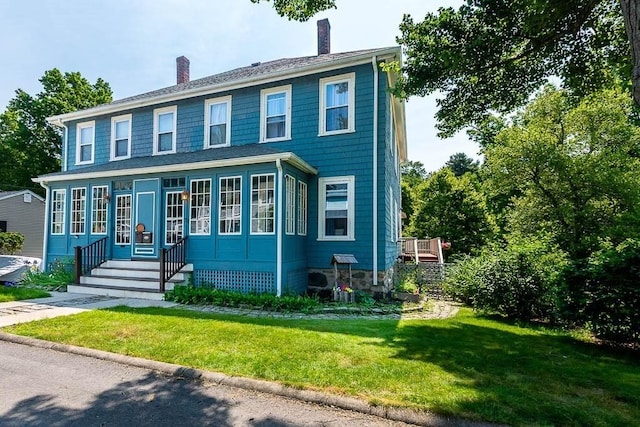 76 Colburn St Unit 76, Dedham, MA 02026 - colonial house featuring a chimney and a front yard