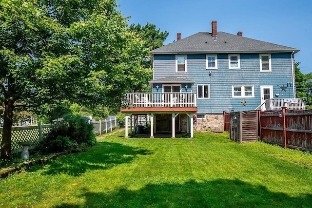 76 Colburn St Unit 76, Dedham, MA 02026 - back of property featuring a deck, a fenced backyard, a chimney, and stairway