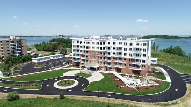 drone / aerial view of a large body of water and apartment complex