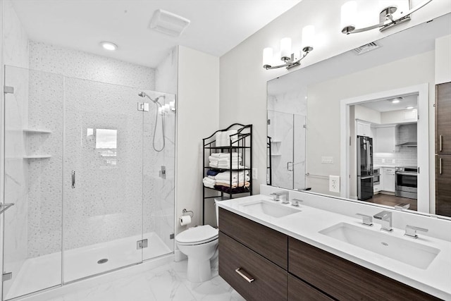 bathroom featuring a shower stall, toilet, marble finish floors, and double vanity
