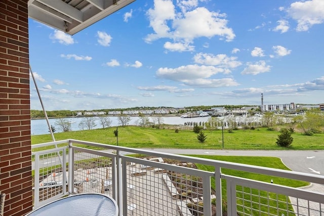 balcony featuring a water view