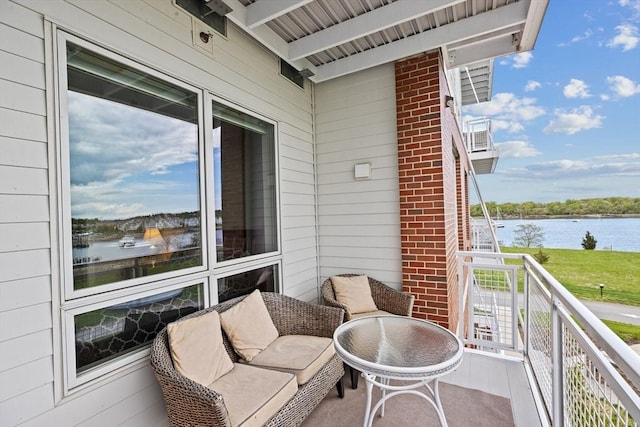 balcony featuring a water view