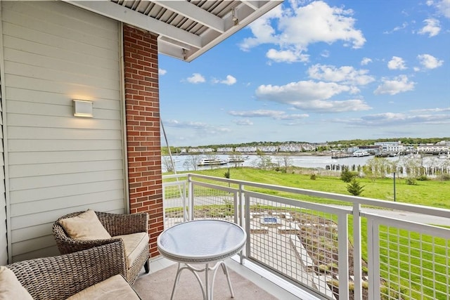 balcony featuring a water view