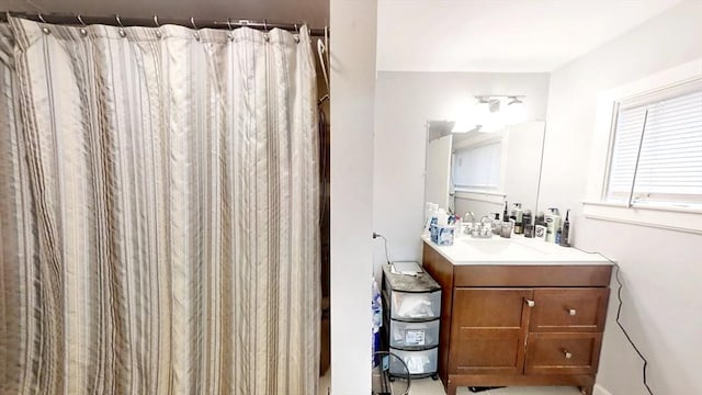 full bathroom with vanity and curtained shower