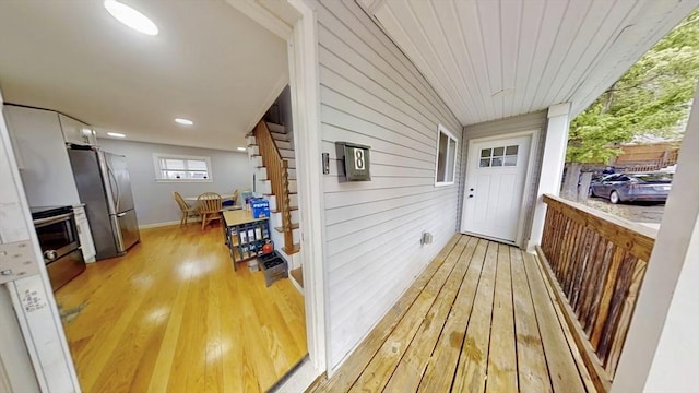 wooden terrace featuring covered porch
